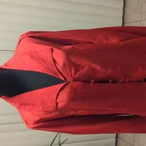 A red polyester women's blouse